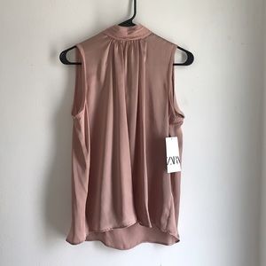 Pale pink high neck silk blouse